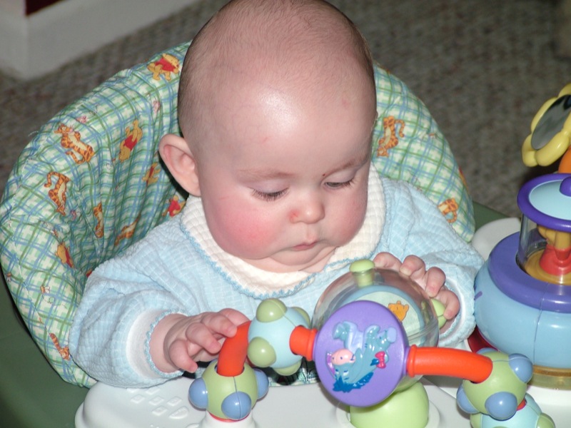 Jakob playing in his walker