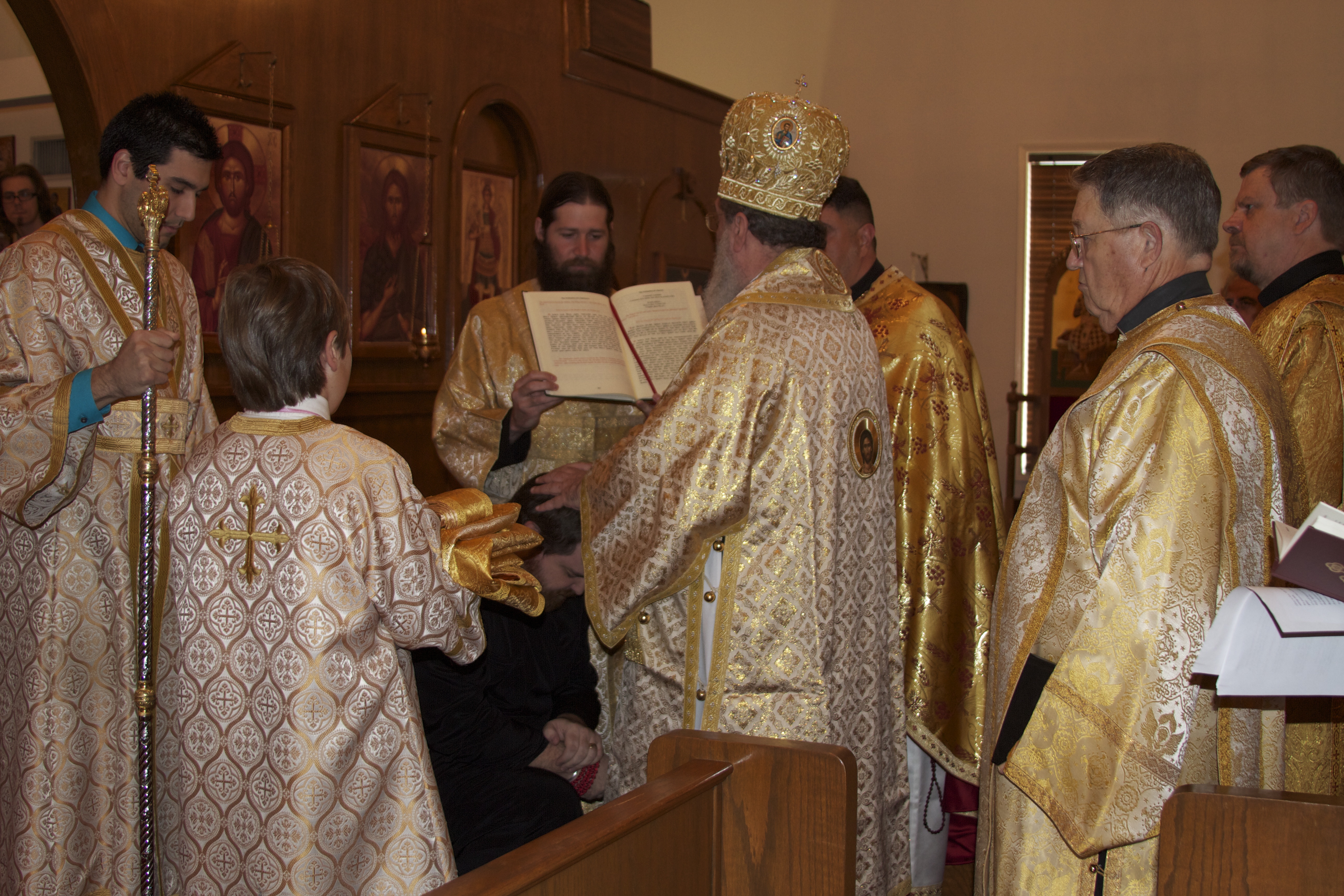 Prayers being said, and vestments brought