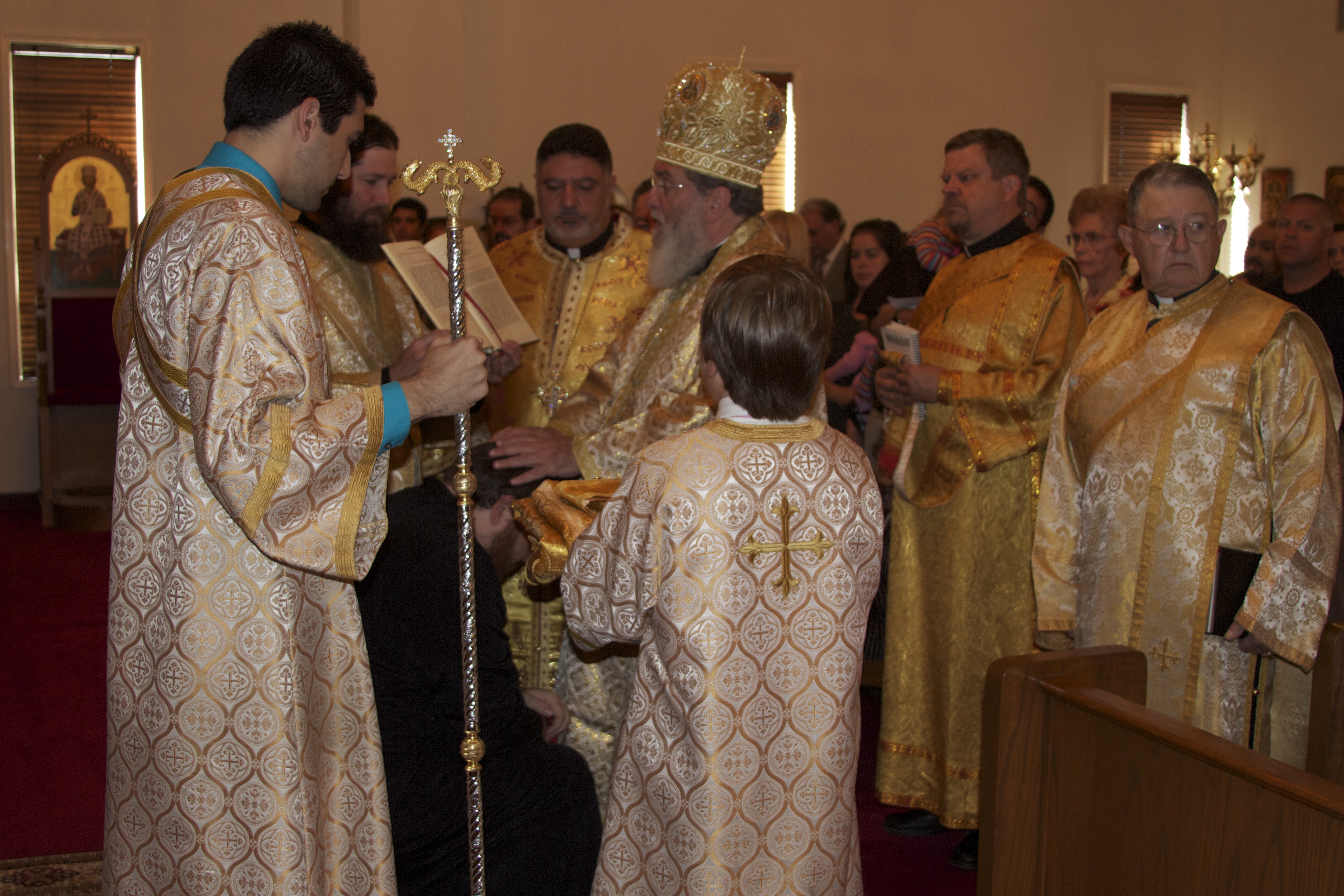 Prayers being said, and vestments brought